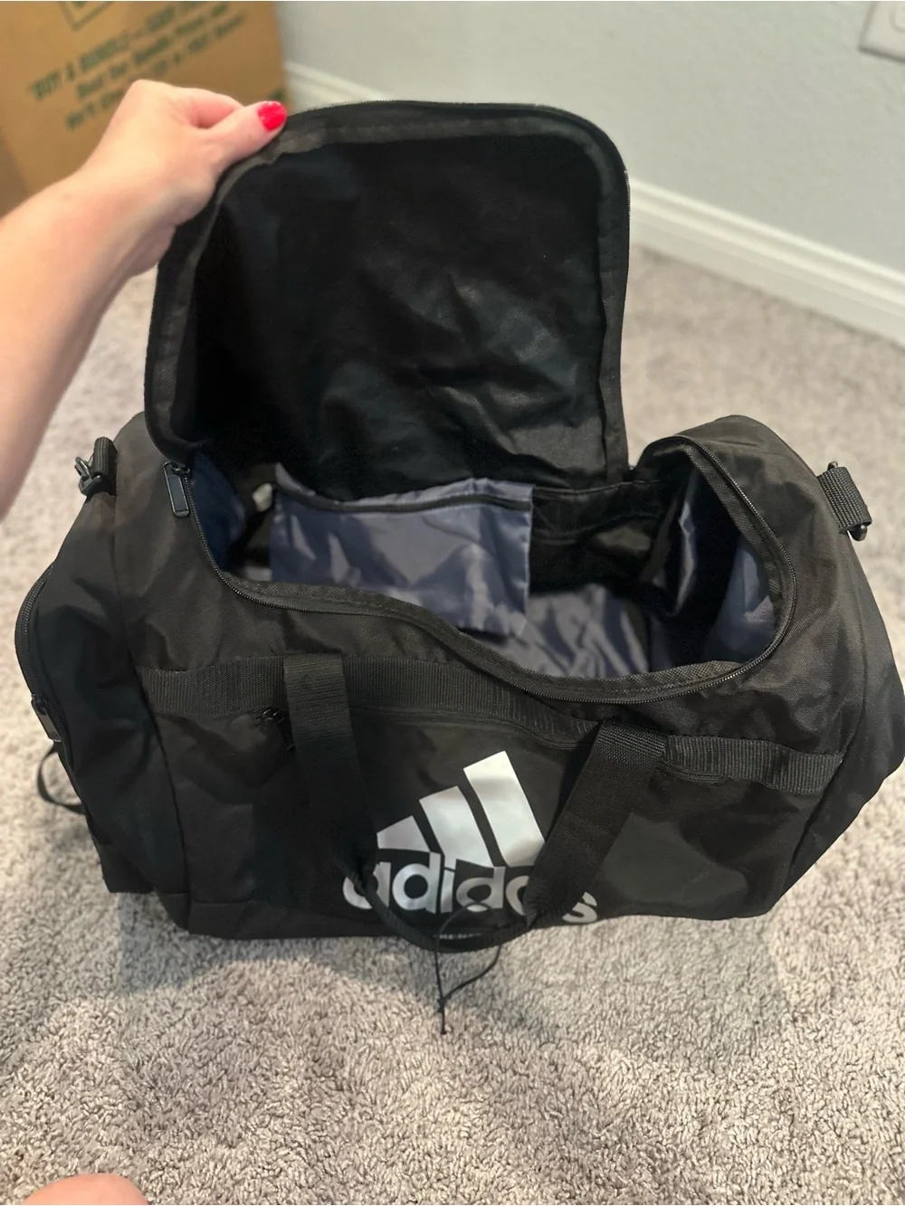 black adidas Defender duffel bag with White Logo
